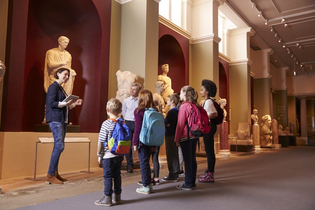 teacher and students in a museum field trip