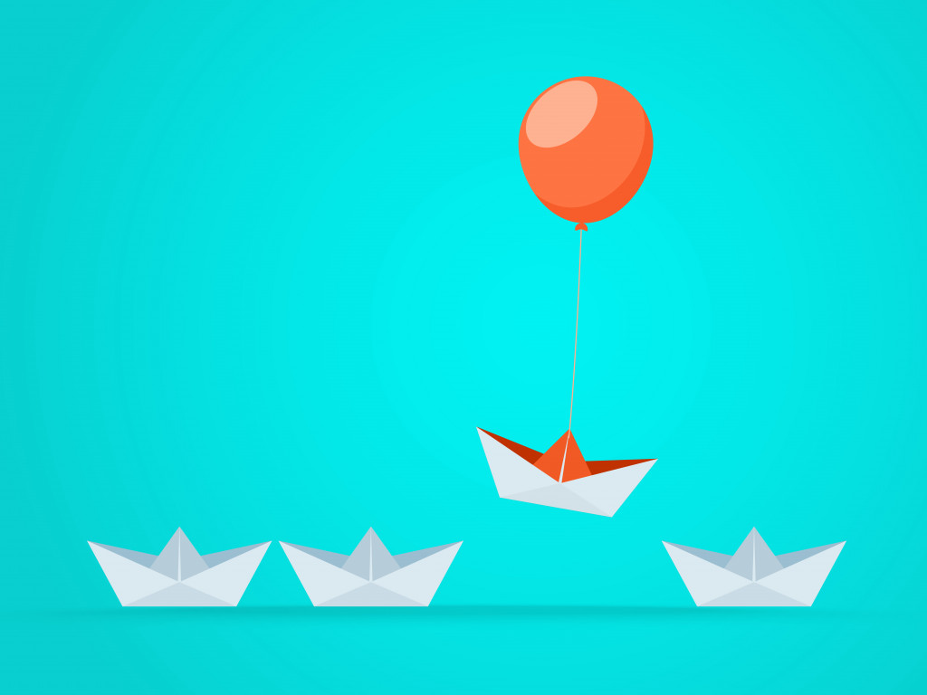 a paperboat and balloon